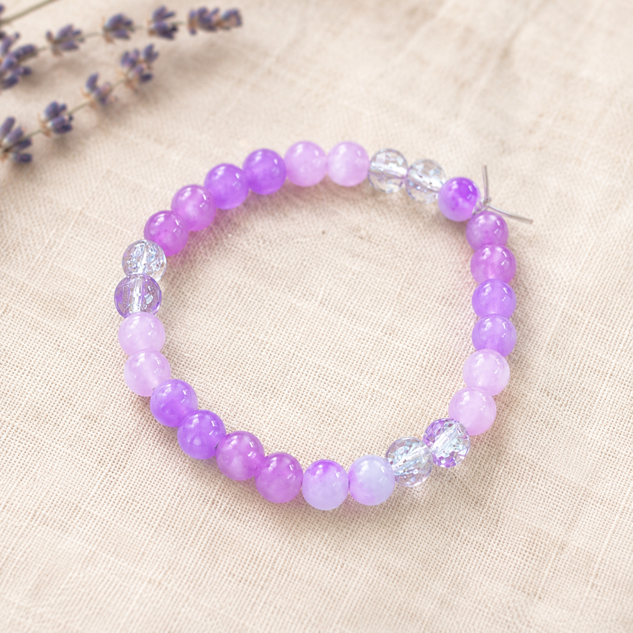 Lavender glass bead bracelet with clear crystals