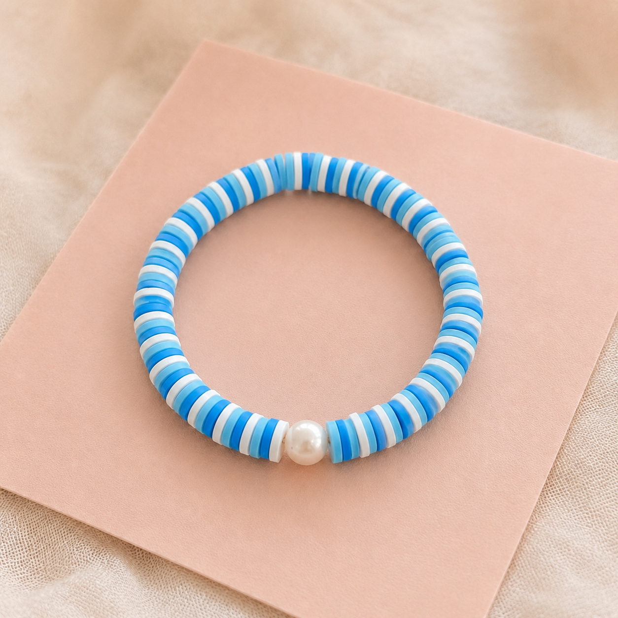 Blue and white striped clay bracelet with pearl